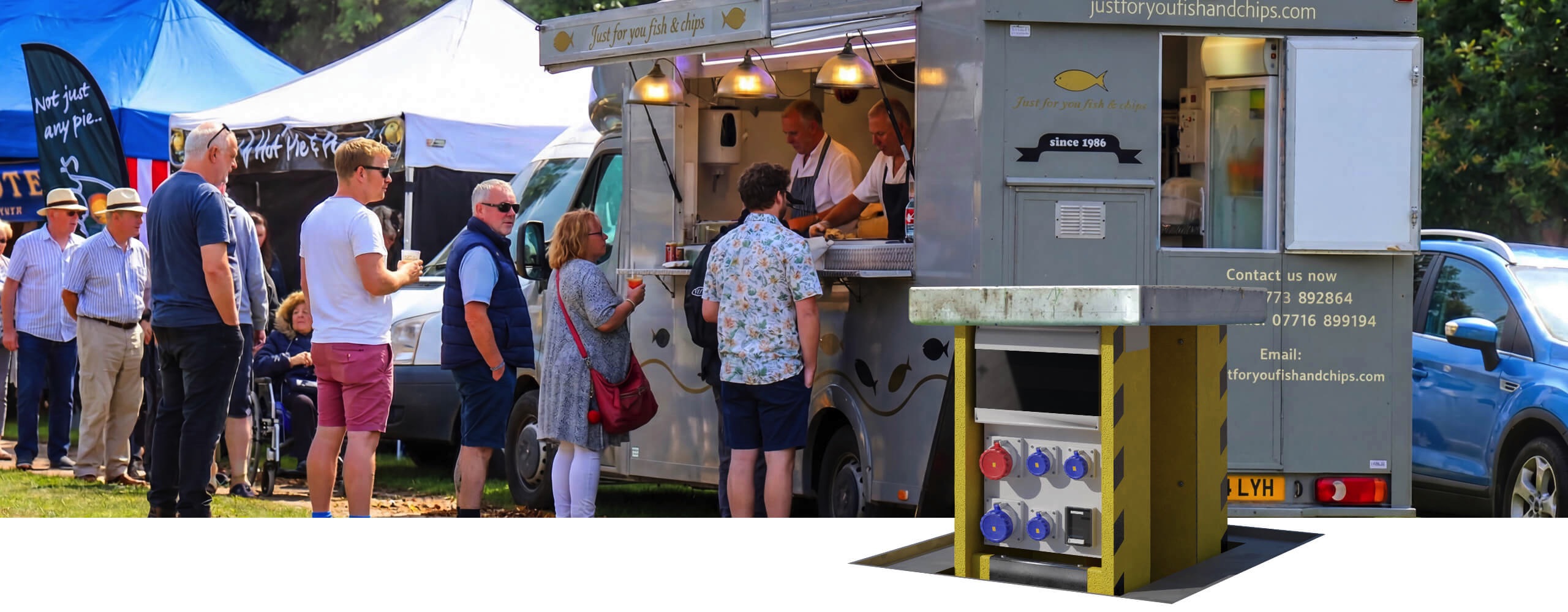 Pop Up Power Supplies Ltd Pop Up unit next to a food van